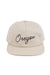 REVOLVR signature embroidered Oregon cap in birch with leather strap on back front view