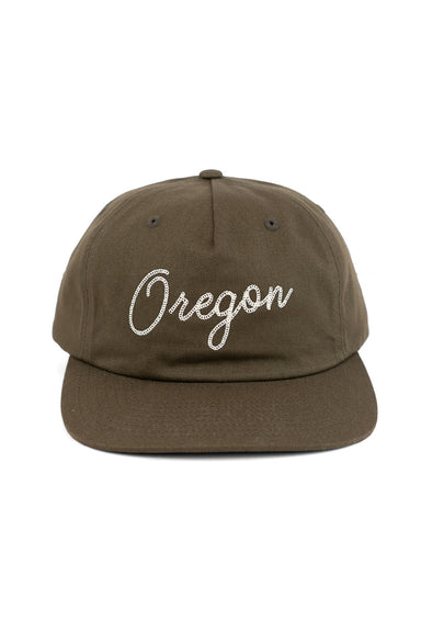 REVOLVR signature embroidered Oregon cap with leather strap on back front view