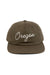 REVOLVR signature embroidered Oregon cap with leather strap on back front view