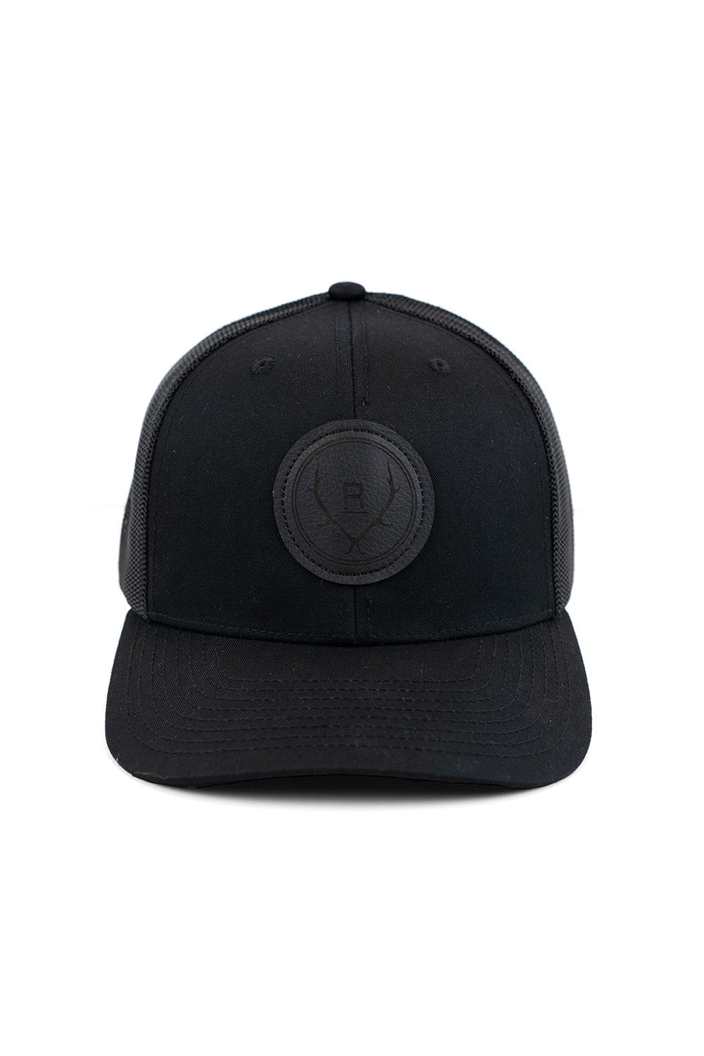 REVOLVR simplify trucker cap in black with leather logo patch on front and adjustable snapback front view