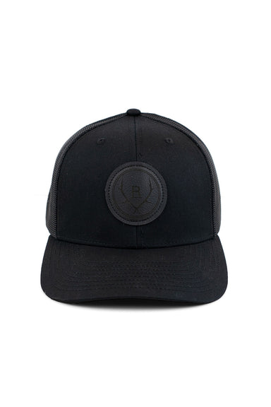 REVOLVR simplify trucker cap in black with leather logo patch on front and adjustable snapback front view