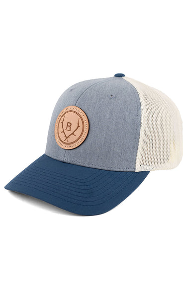 REVOLVR simplify trucker cap in grey, birch and navy with leather logo patch on front and adjustable snapback profile view