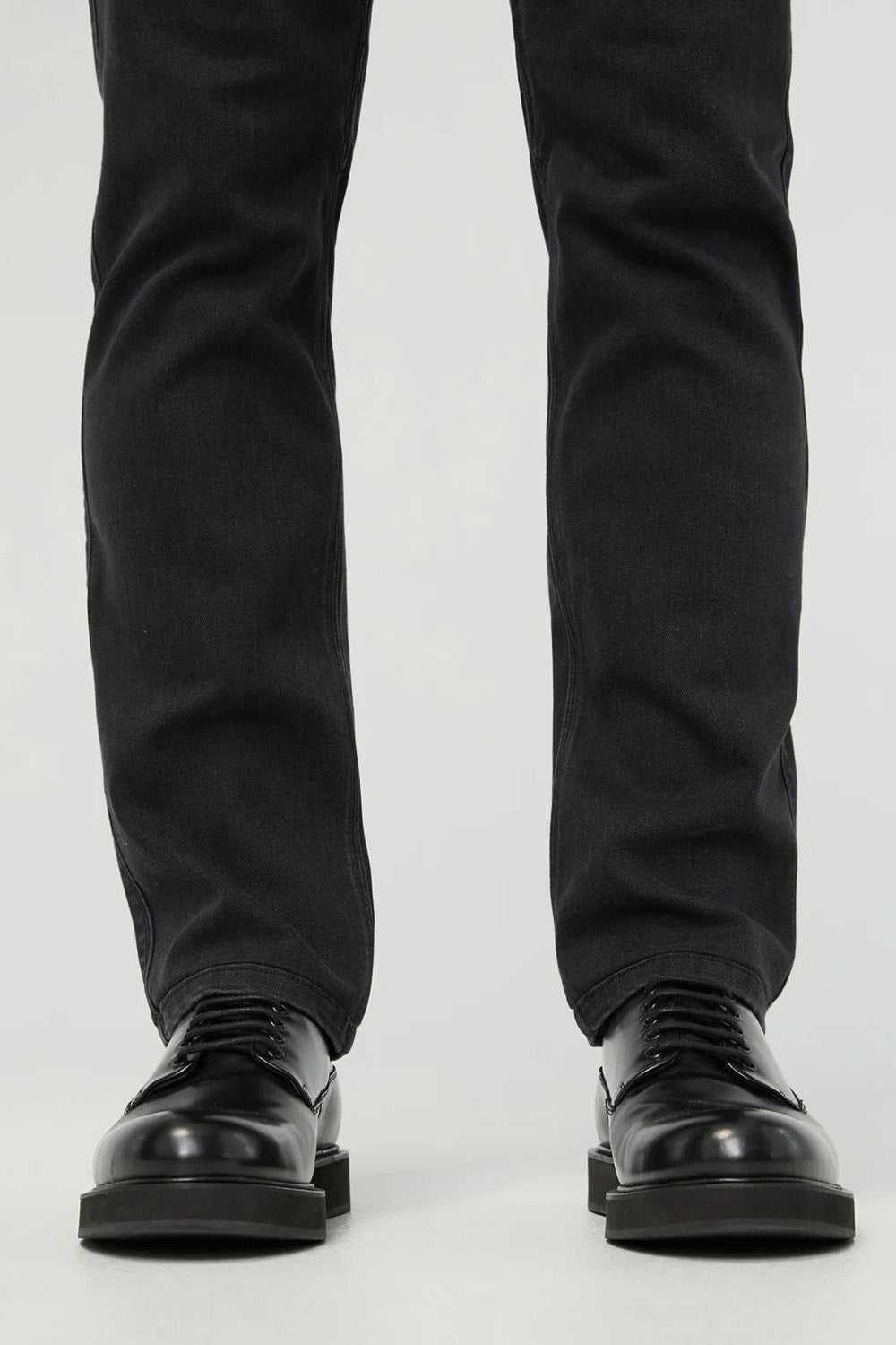 duer-performance-denim-slim-straight-worn-black-hem