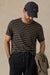 Faherty - Sunwashed Tee - Black Sand Stripe - Model Front
