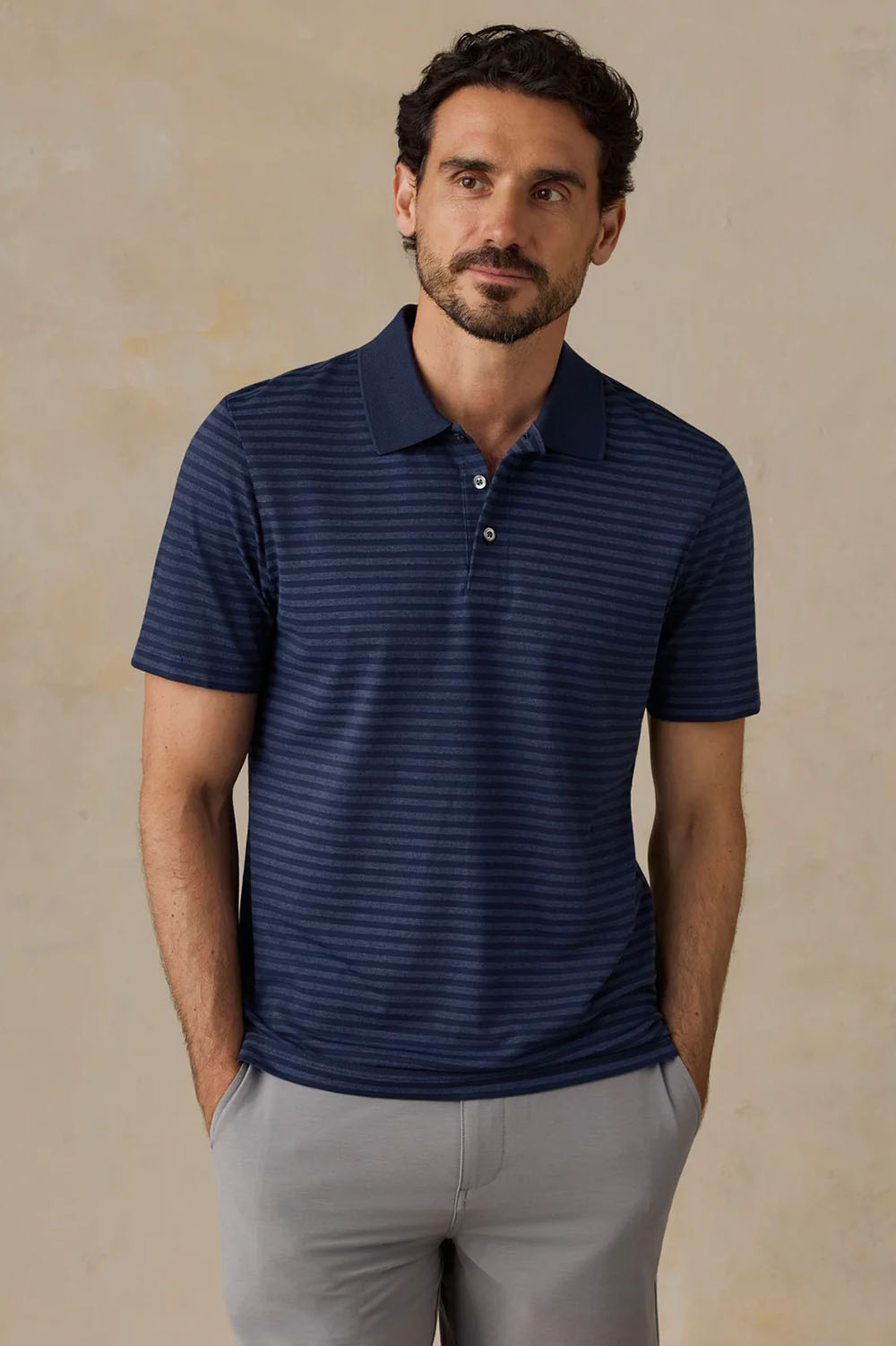 Faherty Movement Pique Polo in Twilight Stream Stripe — Front view