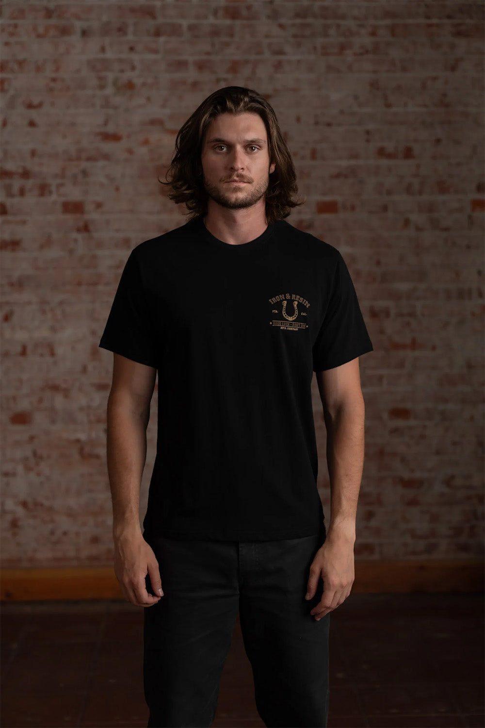 iron and resin lucky horseshoe tee black front