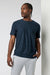 Vuori - Strato Tech Tee - Navy Heather - Model Front Detail