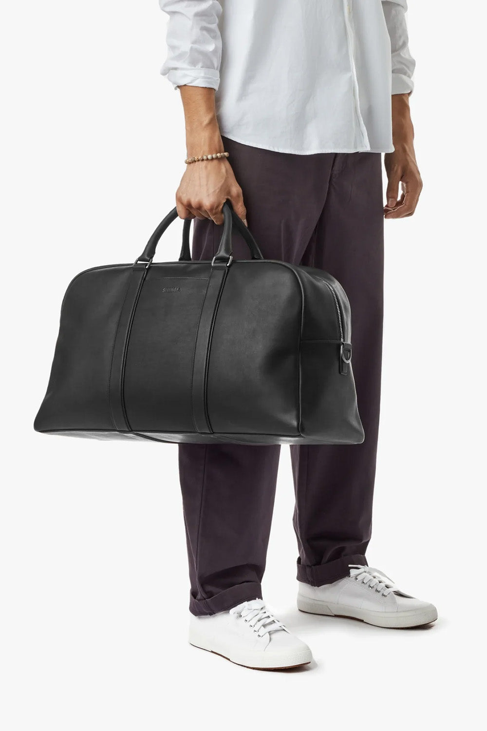 Shinola Runwell Duffle Navigator in Black — Lifestyle view