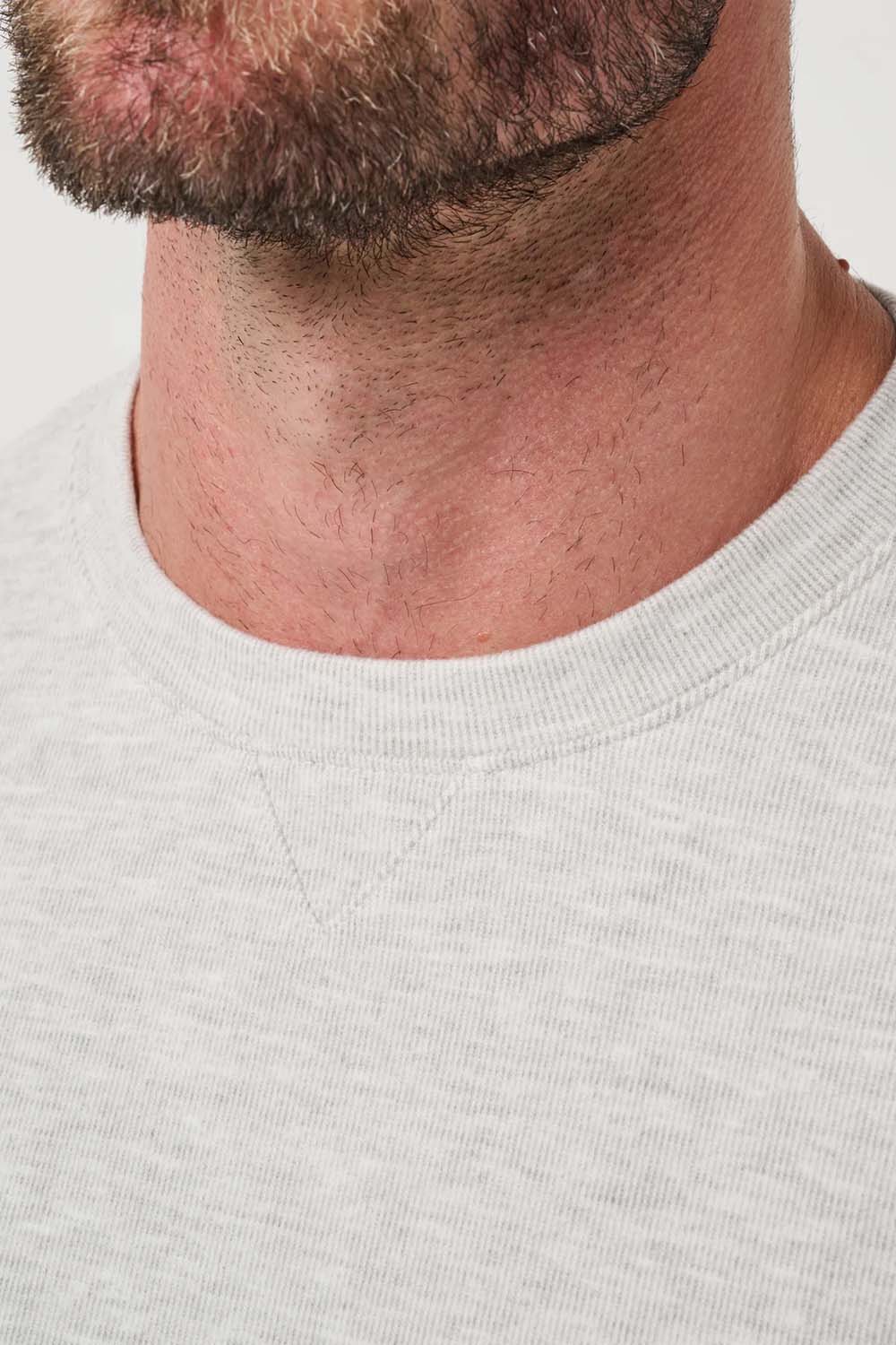 Travis Mathew Cloud Sweater in Heather Grey — Detail neckline view