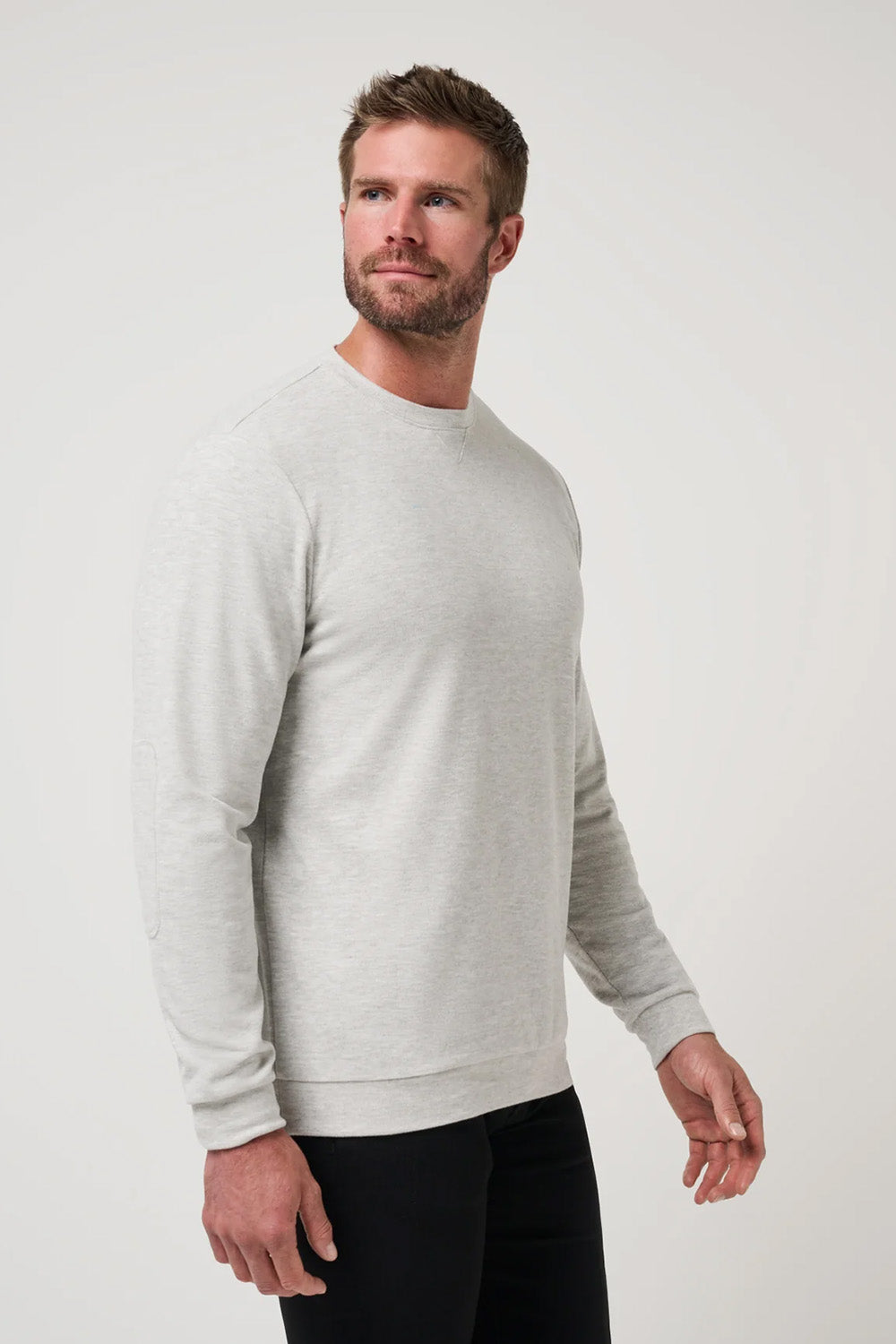 Travis Mathew Cloud Sweater in Heather Grey — Quarter view