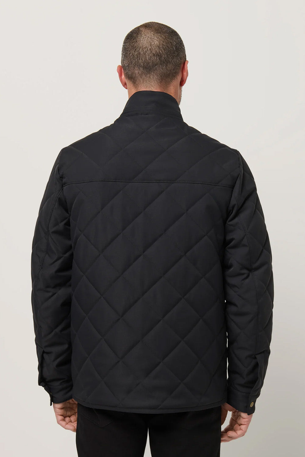 Travis Mathew Highlander Jacket in Black — Back view