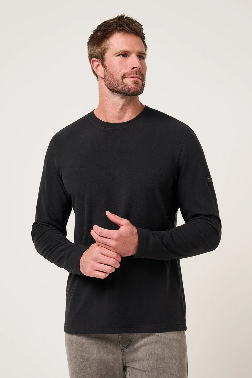 Travis Mathew Peak Fleece Crew in Black — Front view