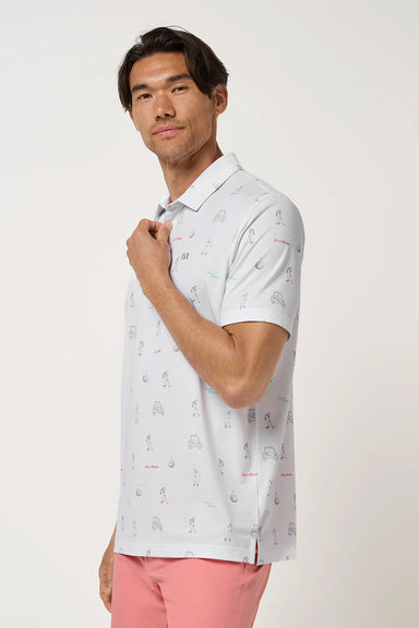 travis mathew on a mission polo in white side view