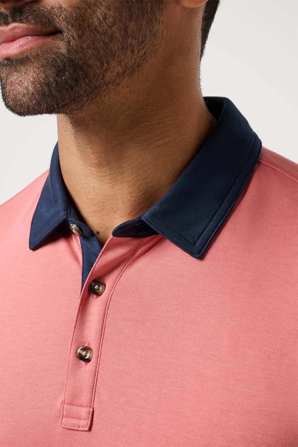 travis mathew all day social club polo brick dust detail