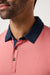 travis mathew all day social club polo brick dust detail
