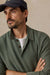 Faherty Sunwashed Sweater Polo in Mountain Green — Quarter view