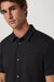Vuori Knit Oxford Shirt in Black — Placket detail view
