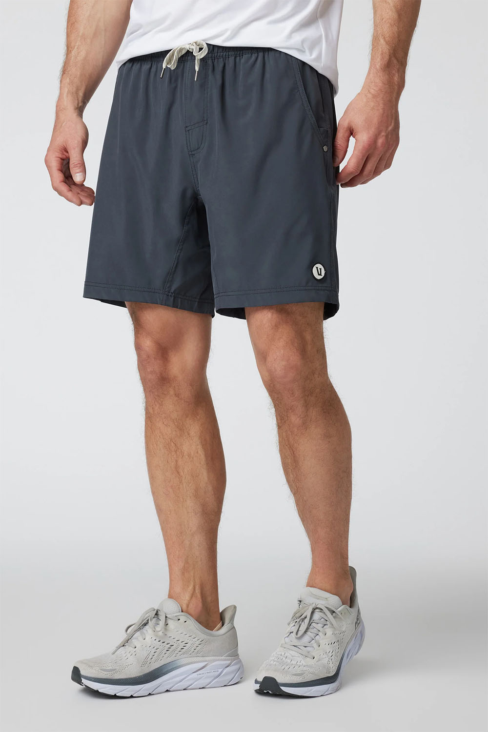 Vuori Kore Short Lined 7" in Charcoal — Front view, on model