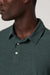 Vuori Strato Tech Polo in Hemlock Heather — Collar detail view