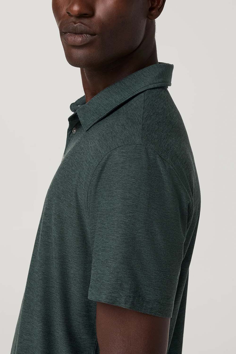 Vuori Strato Tech Polo in Hemlock Heather — Shoulder detail view