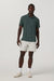 Vuori Strato Tech Polo in Hemlock Heather — Full-body view