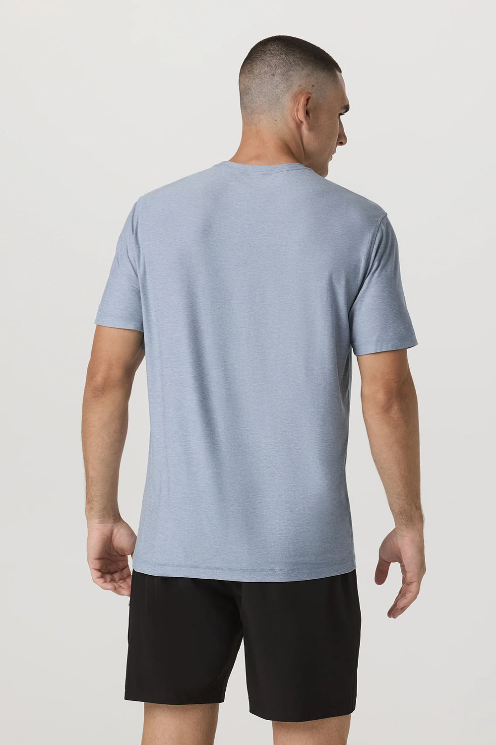 Vuori Strato Tech Tee in Blue Dusk Heather — Back view